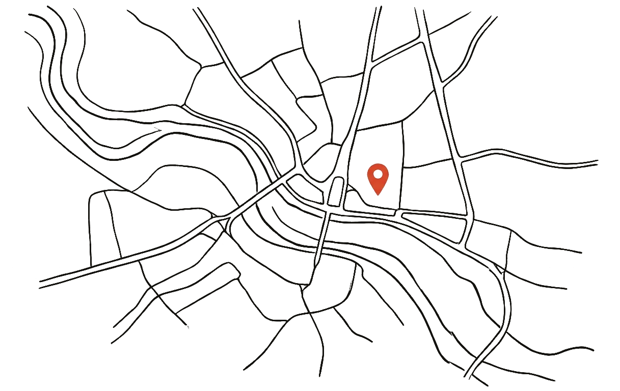 Line drawing of a city map with a red pin marking the studio